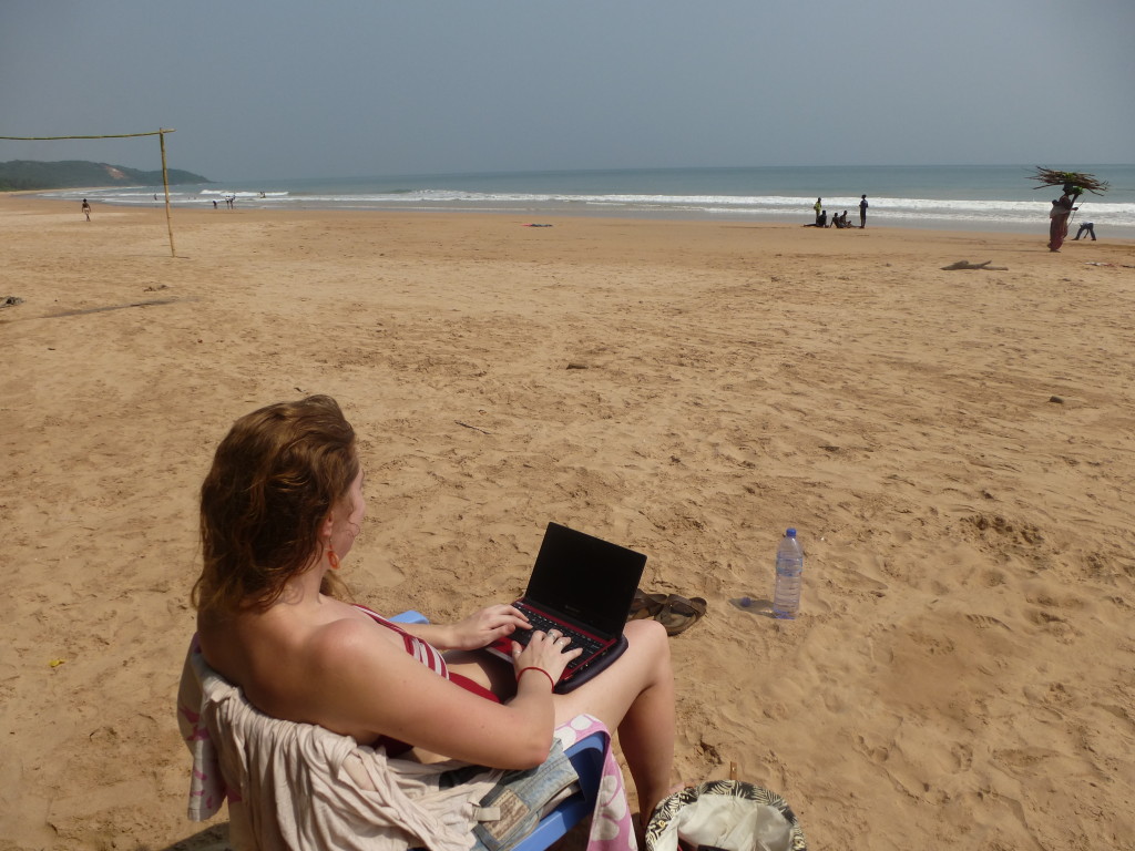Digital nomad laptop on beach