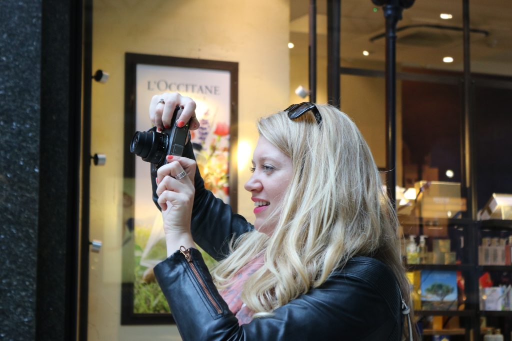 Jen Lowthrop taking photos in Leeds arcade