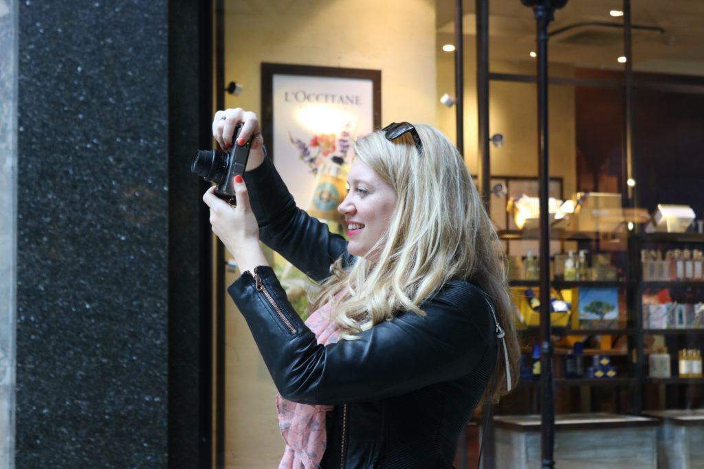 Jen Lowthrop taking photos in Leeds arcade