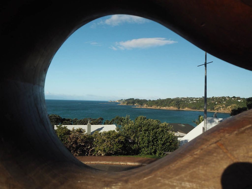 Oneroa Beach views through a statue